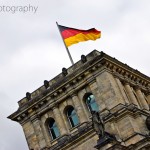 The German flag flies on top of the Reichstag