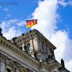 The German flag flies on top of the Reichstag