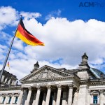 The German flag flies by the Reichstag